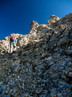 The scrambling terrain turns more serious near the summit ridge.
