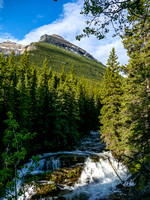 Blakiston Falls with part of Mount Hawkins looming above.