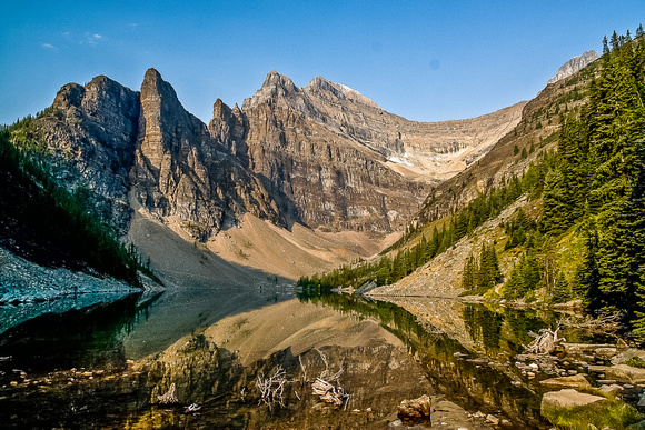Lake Agnes reflects the surrounding terrain perfectly.