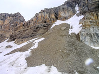 Very steep scree / shale / mud slopes to snow on the west aspect of the peak.