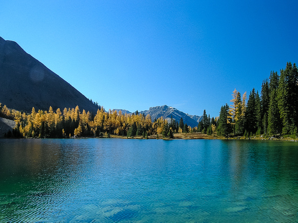 Gorgeous blue waters of Chester Lake with bright larches make for a very nice hike.