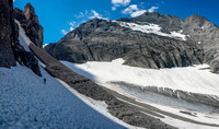 Grant traverses steep snow slopes beneath Mount Robertson towards Prairie Lookout.