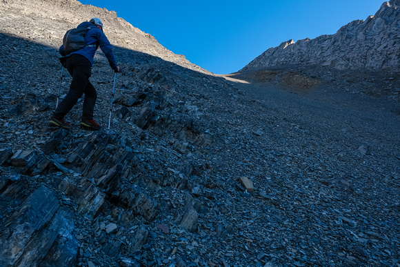 Using rocky ribs to ascend steeper slopes to the col.