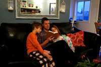 Dad reads the Christmas story.