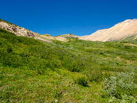 Hiking the Afternoon meadows between Afternoon and Frances Peak (L) and Mount McDonald (R).