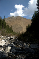 This is looking up the creek at the ascent slope. The creek splits into two around the orange shale slope up ahead.