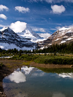 Assiniboine is reflected in a tarn on our way up The Nub.