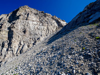 Scrambling loose rubble slopes to the NW2 col.